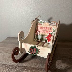 Festive Wooden Sleigh with Holiday Accents
